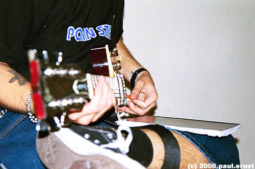 Roe playing guitar; Actual size=180 pixels wide